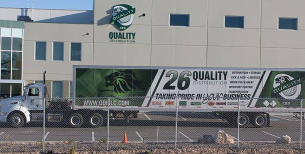 Modern 3PL warehouse with forklift loading pallets for distribution.