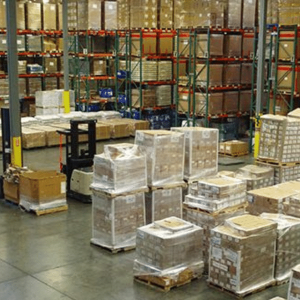 Logistics team reviewing warehouse inventory strategy