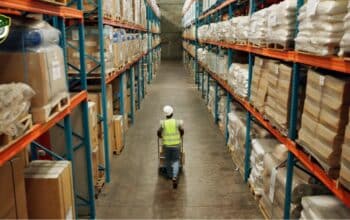 Modern commercial storage warehouse with organized pallets and boxes.