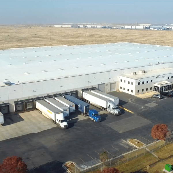 Warehouse staff using technology to track inventory in real time